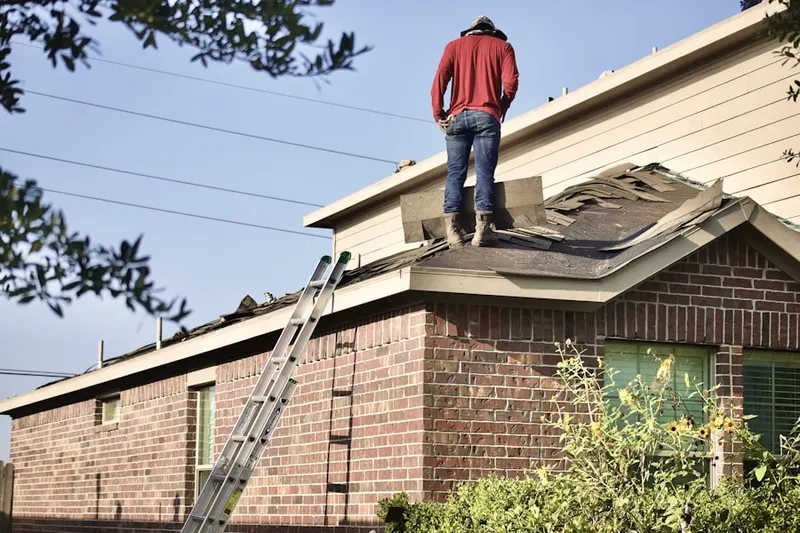Professional roofer working on a residential roof in Mammoth Lakes